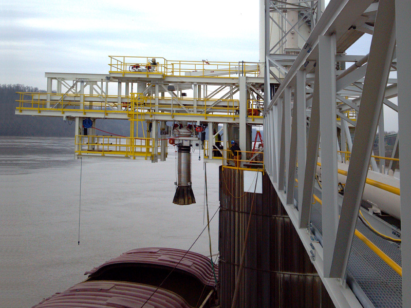 Barge Loading, positionable loading spout, retractable loading spout, loading chute.